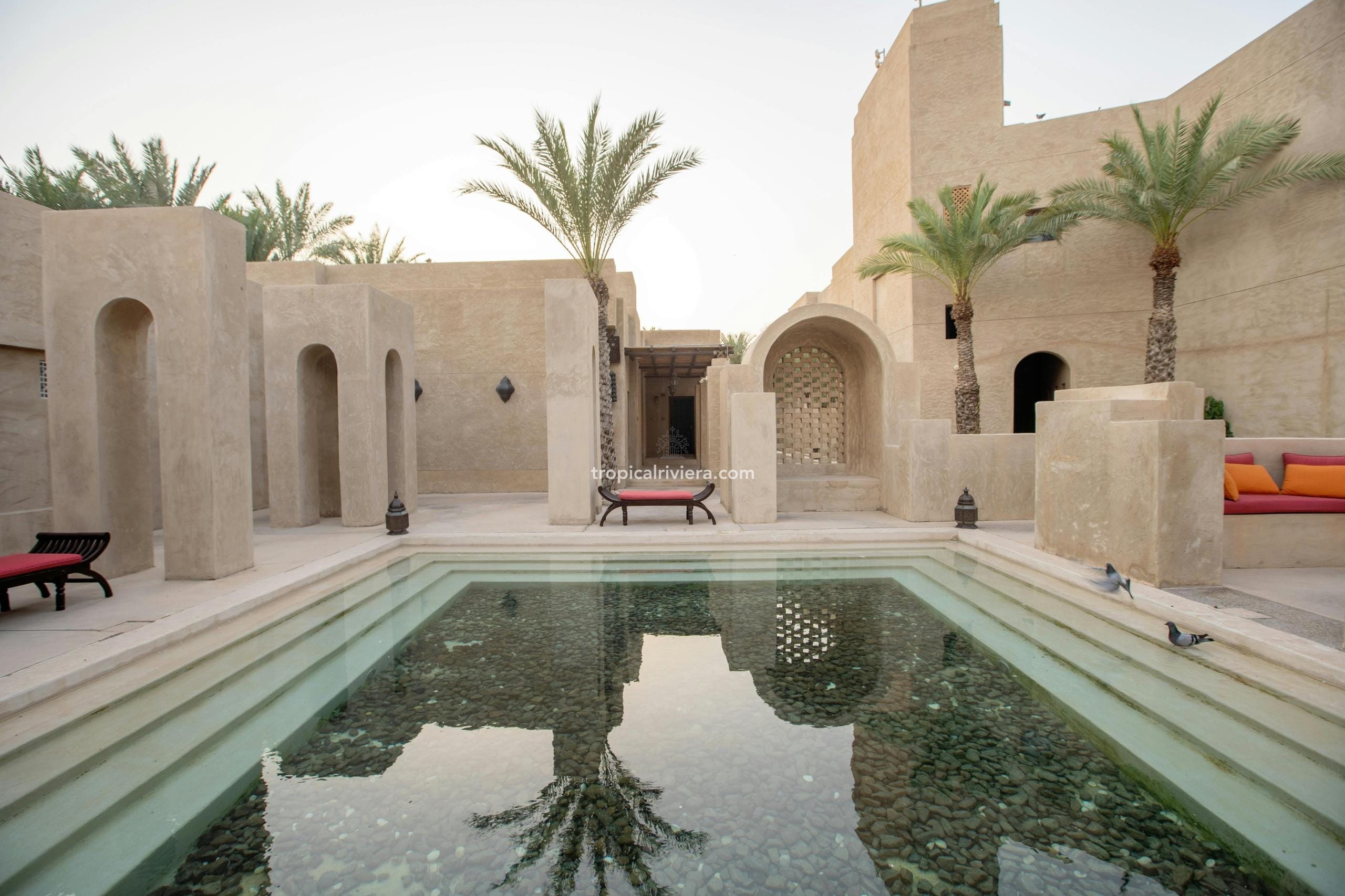 Luxury real estate in Muscat, Oman — cliffside and coastal residences overlooking the Arabian Sea