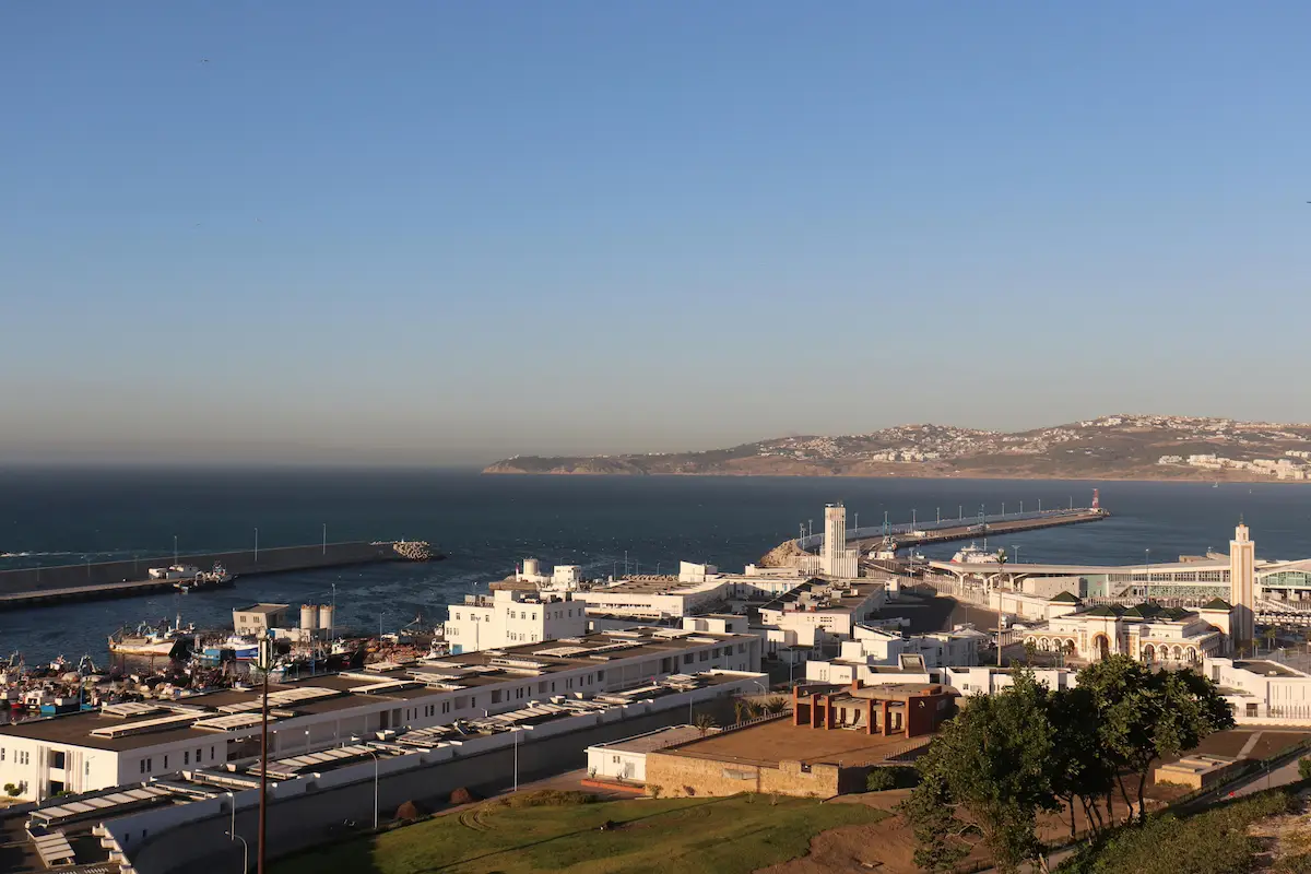 Coastal harbour and hillside cityscape