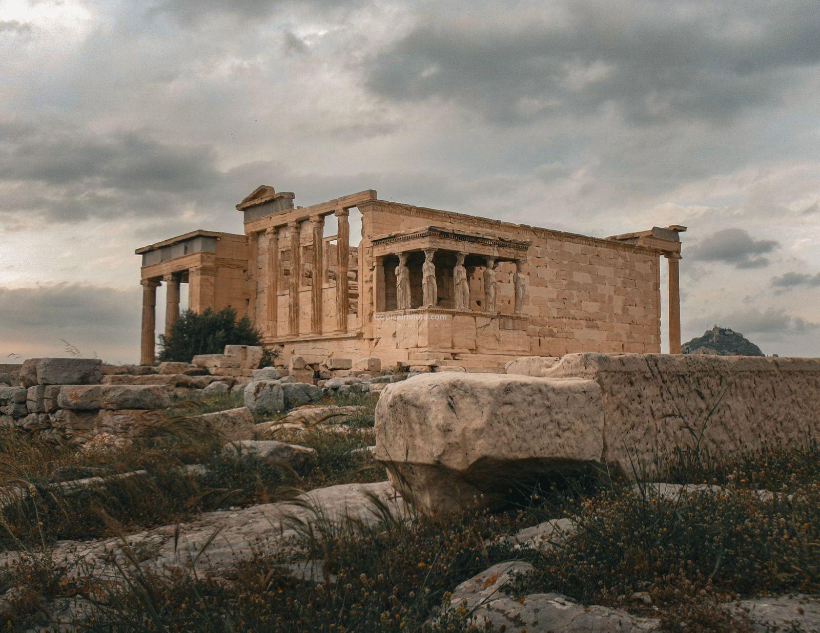 Ancient Greek temple with sculpted columns at the Acropolis in Athens
